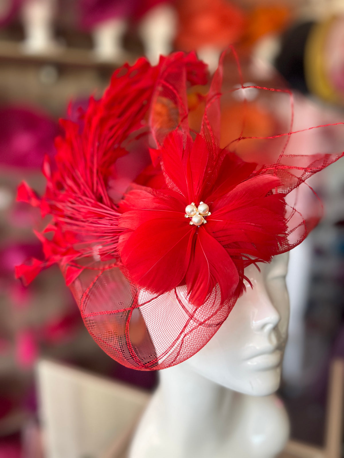 Red Pillbox Fascinator With An Array Of Feathers &amp; Feather Flower With Pearl Detail
