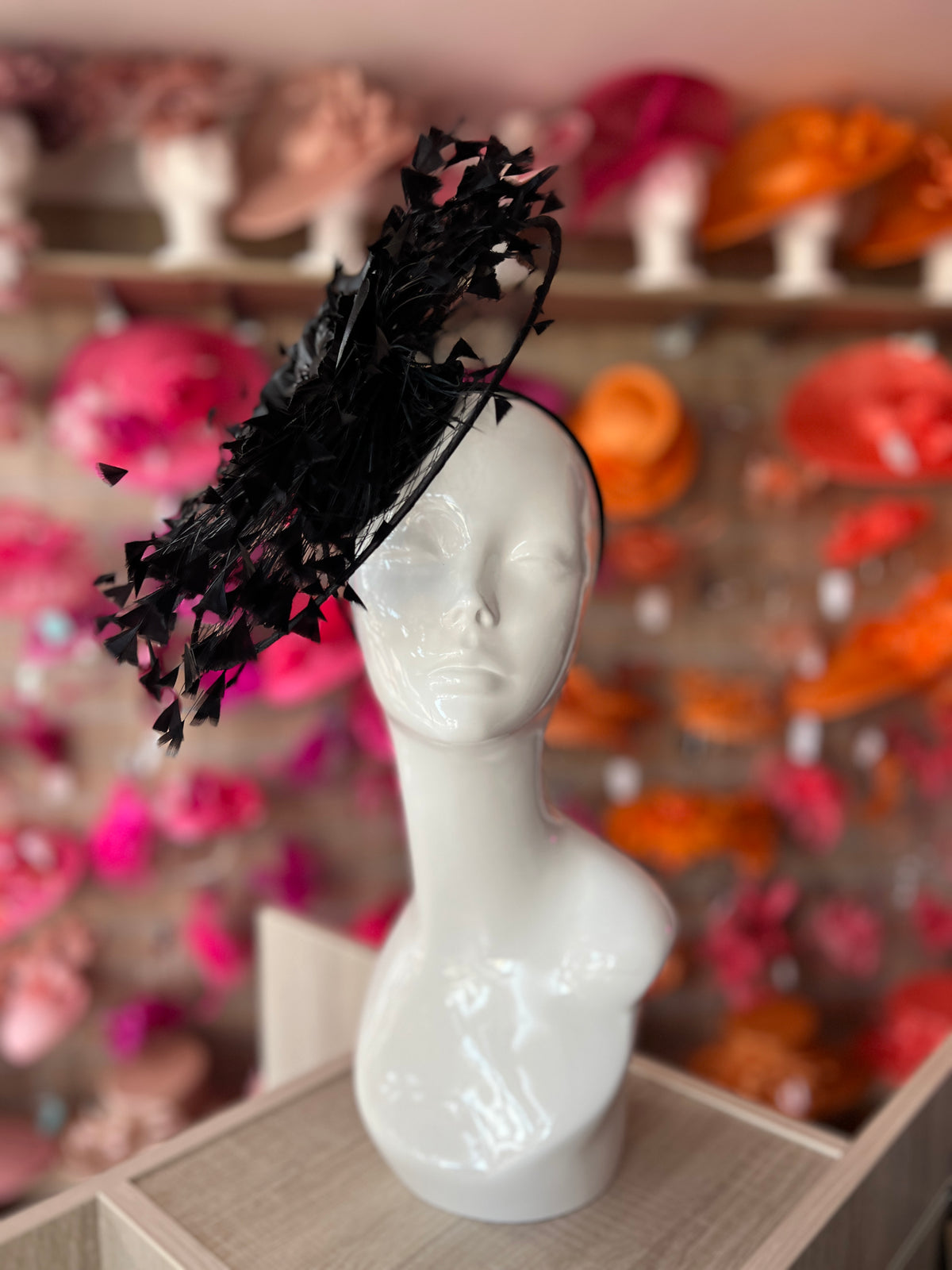 Black Saucer Hatinator With Array Of Feathers &amp; Satin Flower