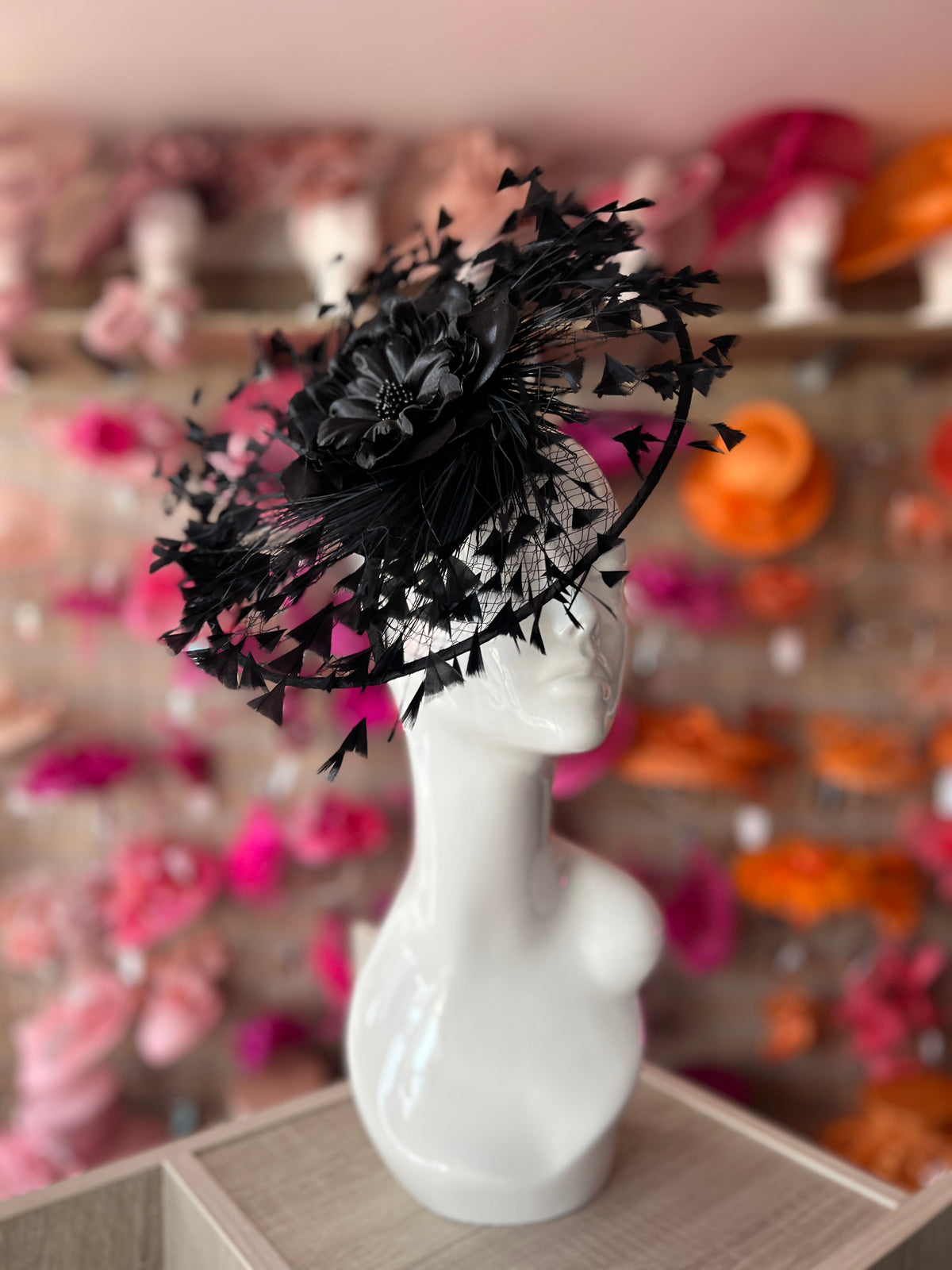 Black Saucer Hatinator With Array Of Feathers &amp; Satin Flower