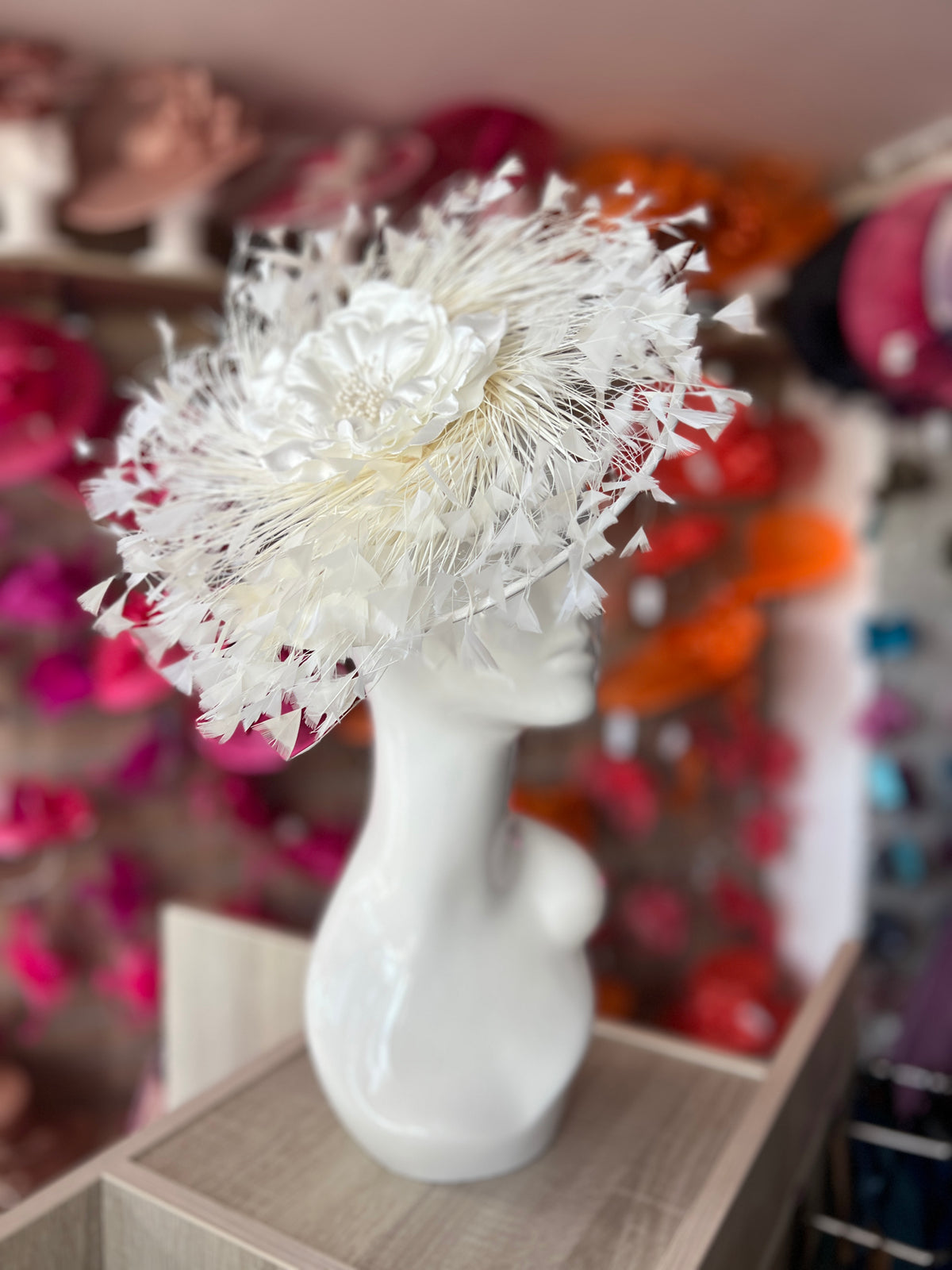 Ivory Saucer Hatinator With Array Of Feathers &amp; Satin Flower