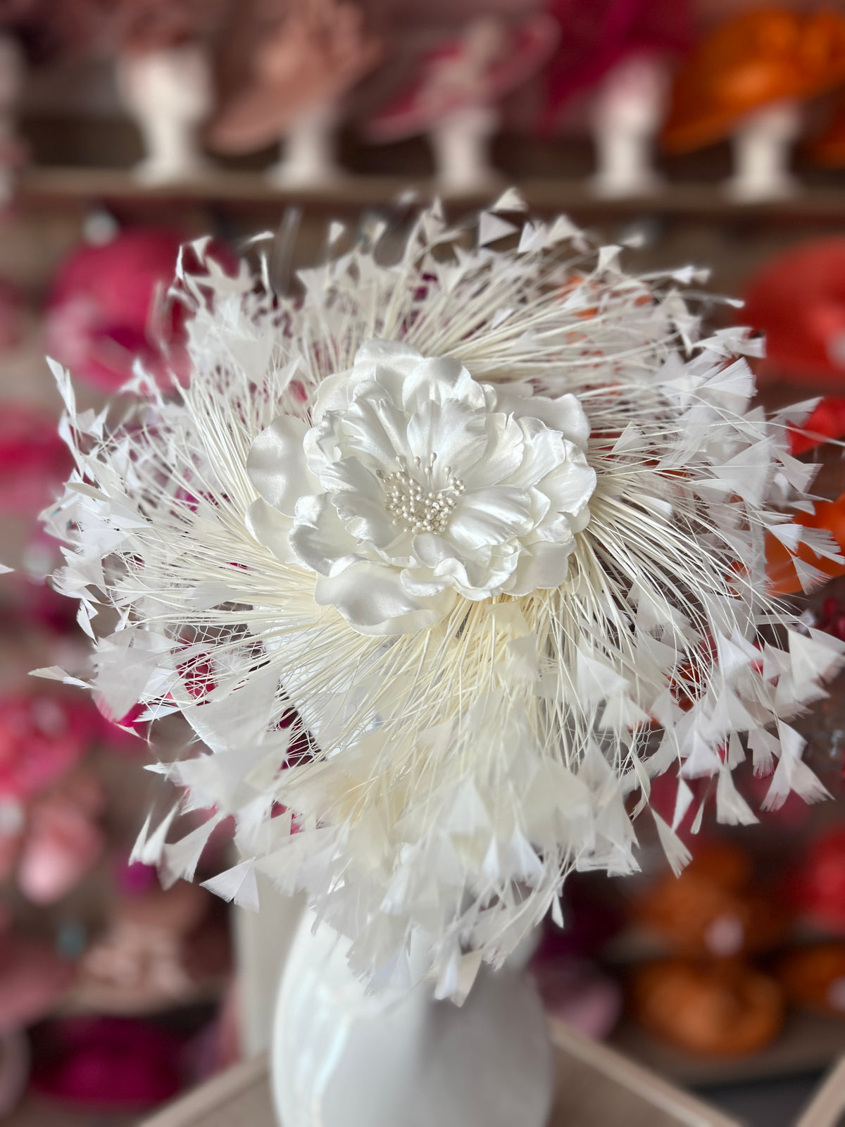 Ivory Saucer Hatinator With Array Of Feathers &amp; Satin Flower