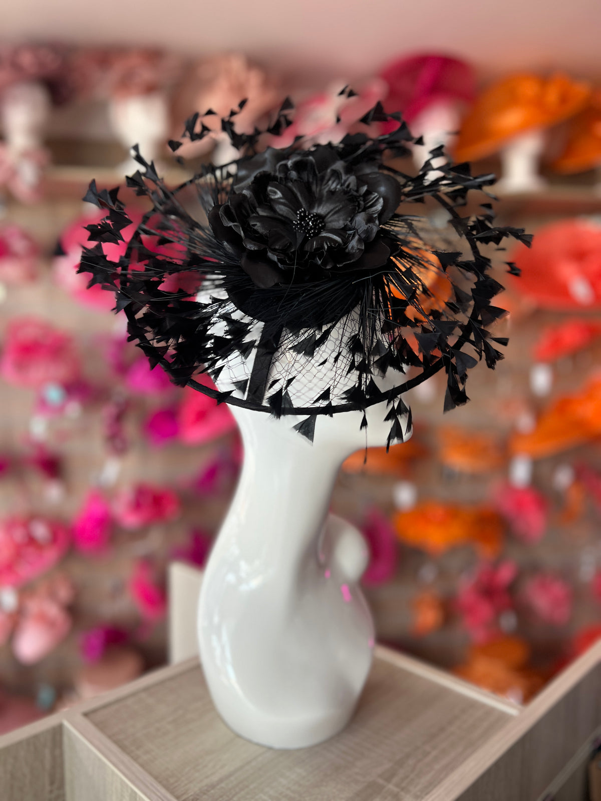 Black Saucer Hatinator With Array Of Feathers &amp; Satin Flower