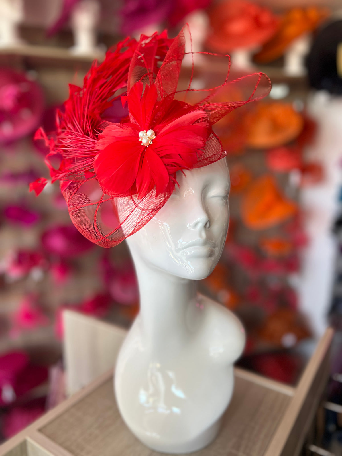 Red Pillbox Fascinator With An Array Of Feathers &amp; Feather Flower With Pearl Detail