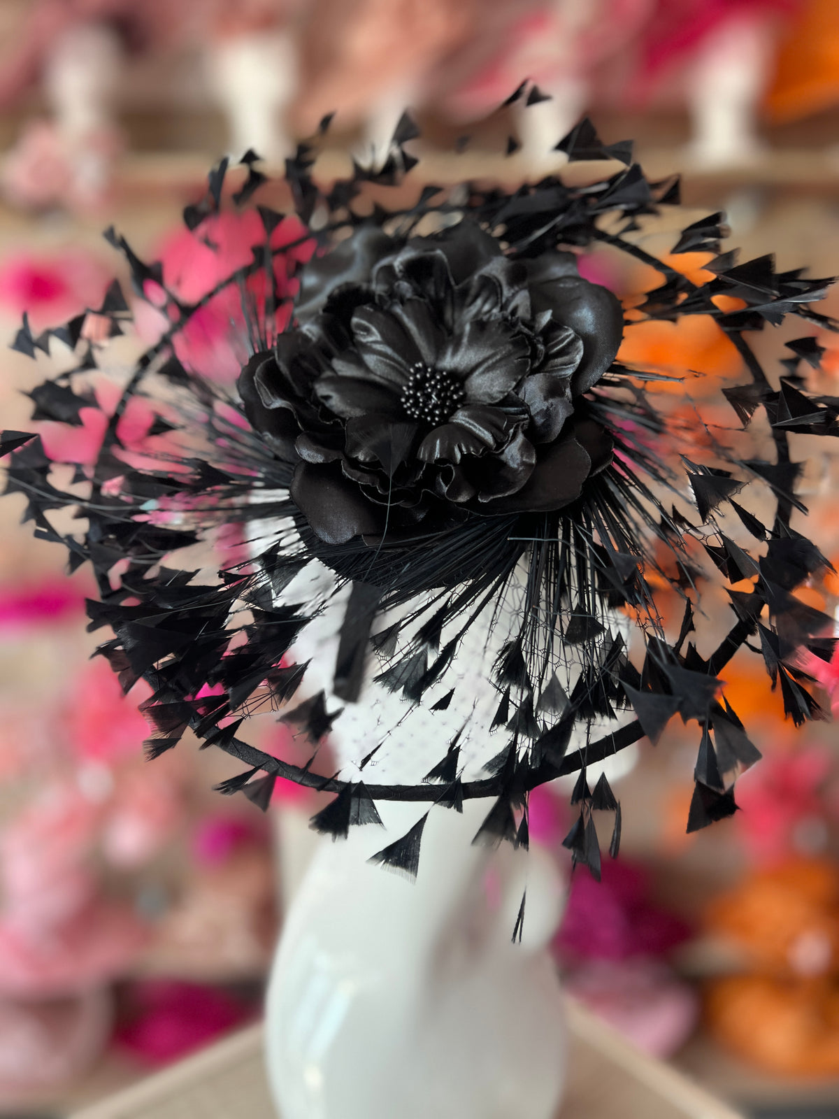 Black Saucer Hatinator With Array Of Feathers &amp; Satin Flower