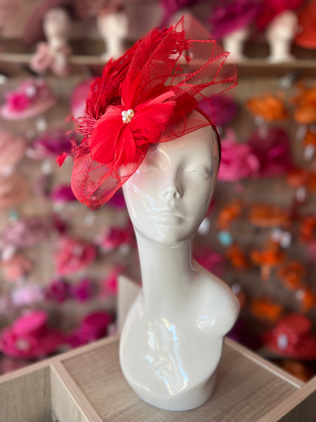 Red Pillbox Fascinator With An Array Of Feathers &amp; Feather Flower With Pearl Detail