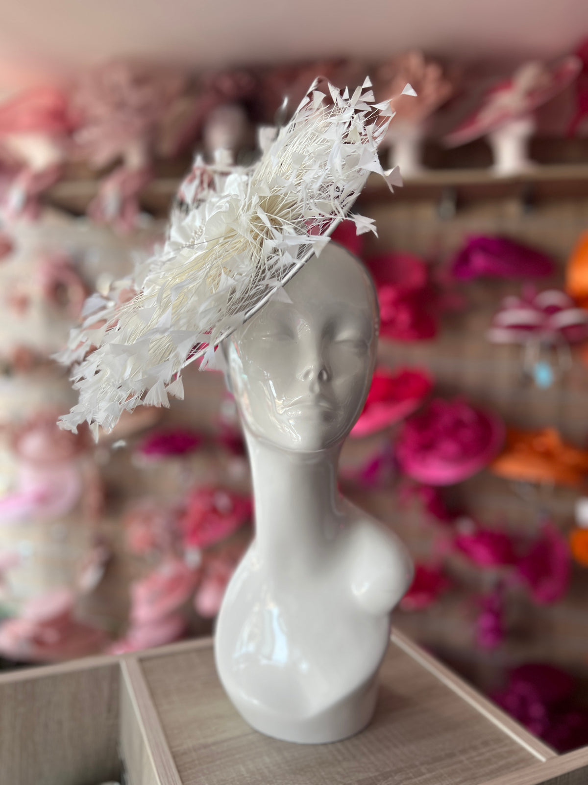 Ivory Saucer Hatinator With Array Of Feathers &amp; Satin Flower