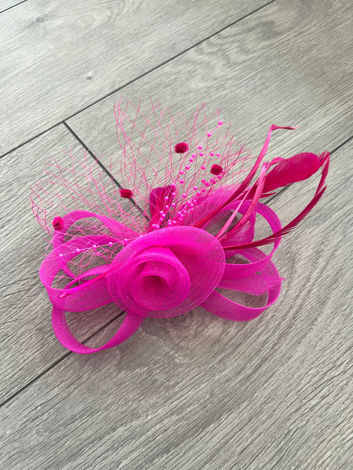 Pink outlet round fascinator with loops, netting and barb quills!