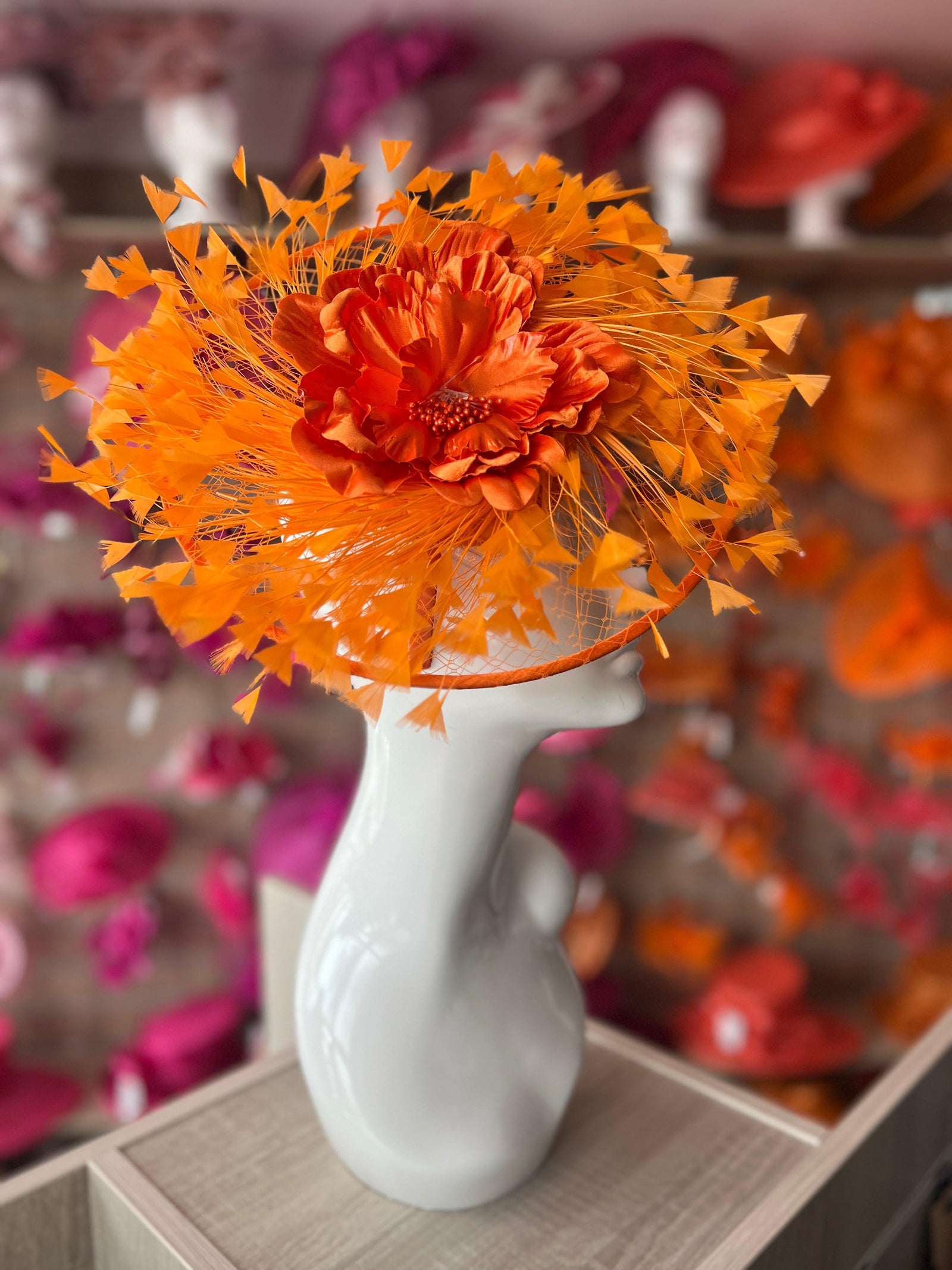Orange Saucer Hatinator With Array Of Feathers & Satin Flower-Fascinators Direct