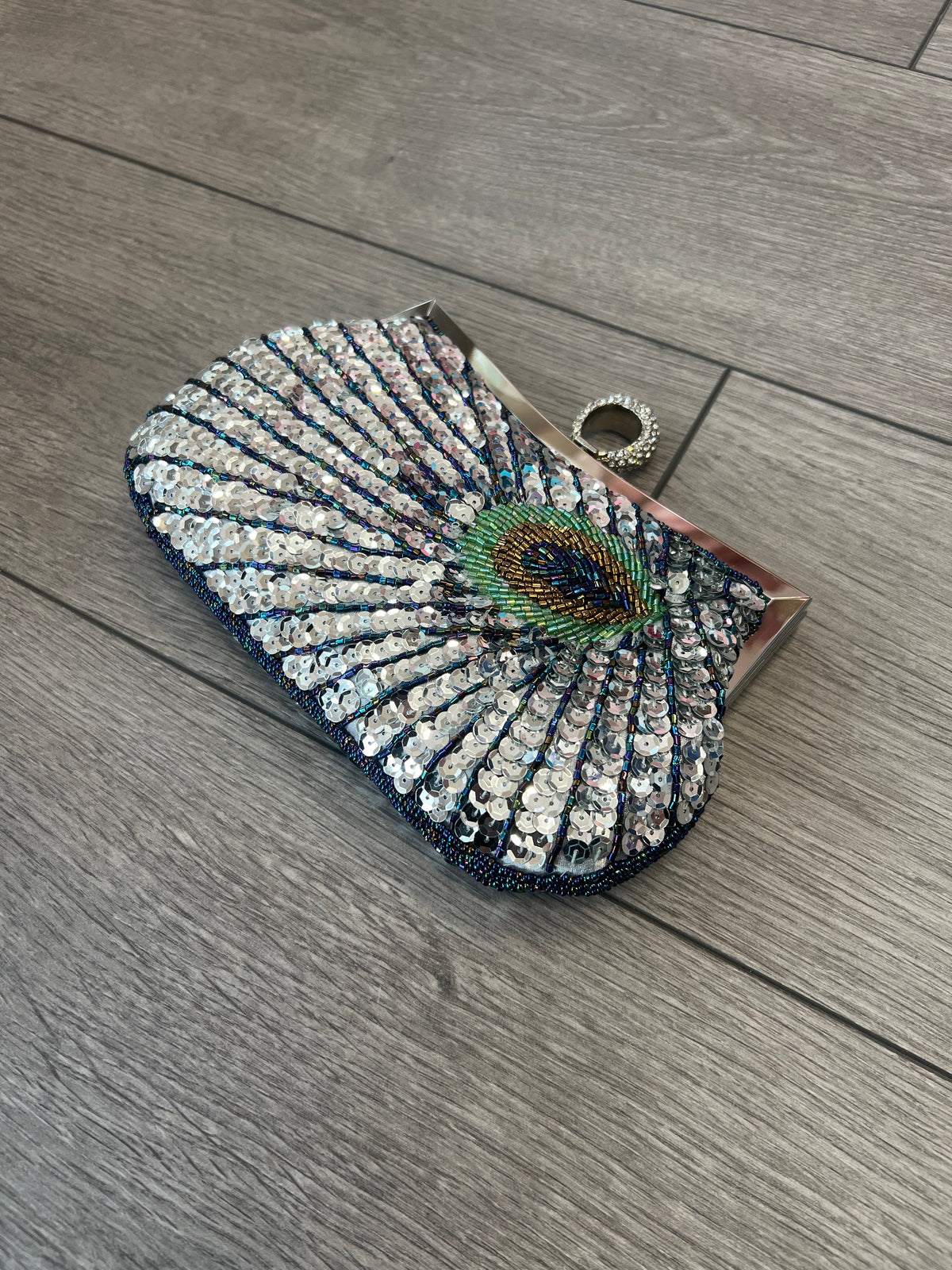 Peacock clutch online