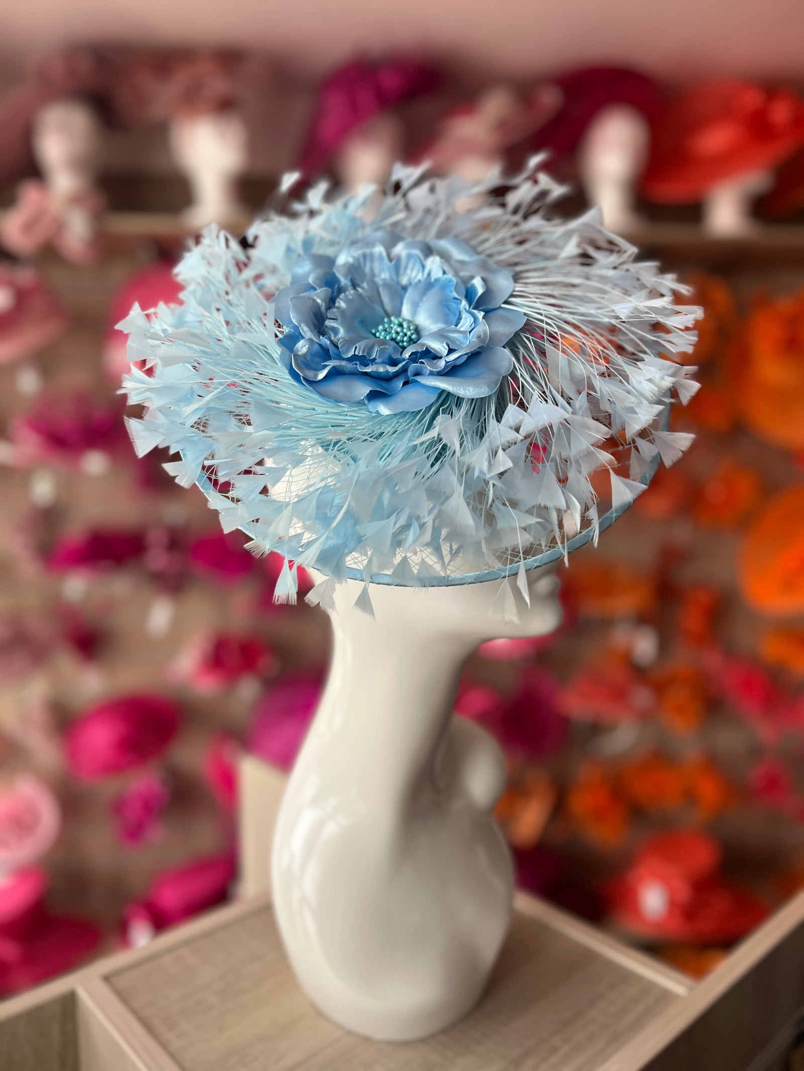 Powder Blue Saucer Hatinator With Array Of Feathers & Satin Flower-Fascinators Direct