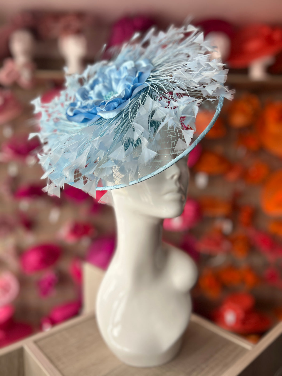 Powder Blue Saucer Hatinator With Array Of Feathers &amp; Satin Flower