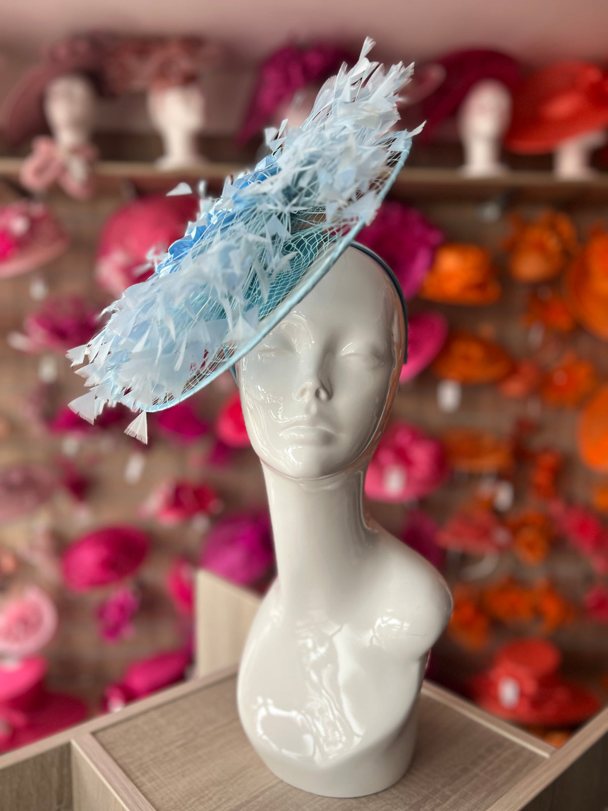 Powder Blue Saucer Hatinator With Array Of Feathers &amp; Satin Flower