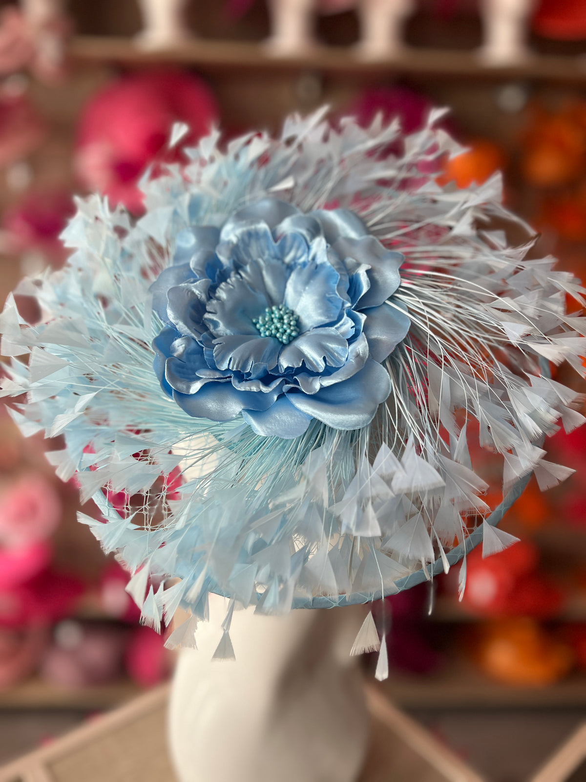 Powder Blue Saucer Hatinator With Array Of Feathers &amp; Satin Flower