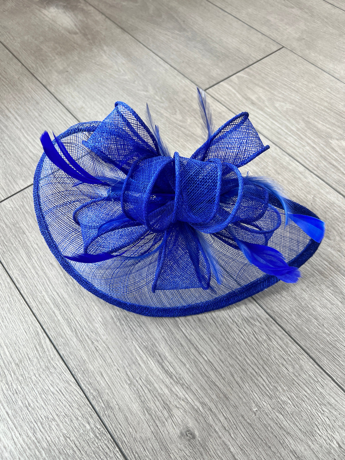 Cobalt blue hotsell fascinator with loops, pink flower and barb quill on a headband!